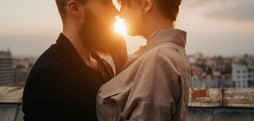 Young couple kissing during evening date