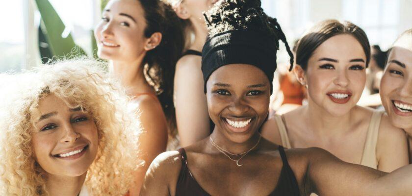 Selfie of smiling multiethnic sportswomen