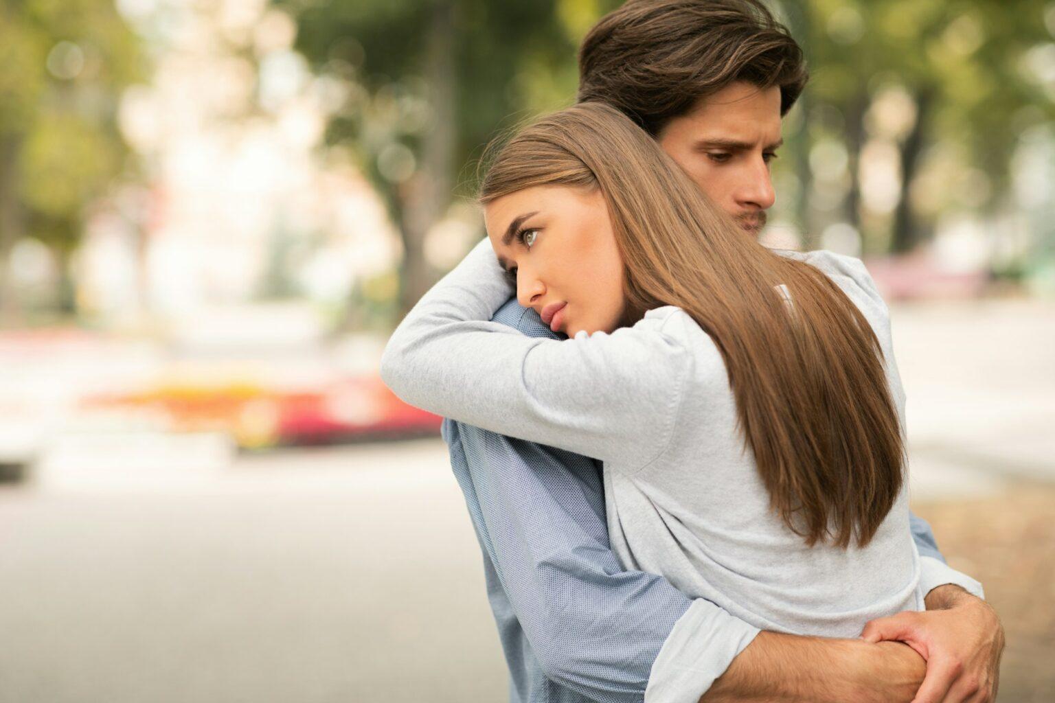 Sad Guy And Girl Hugging Feeling Unloved Standing Outdoors