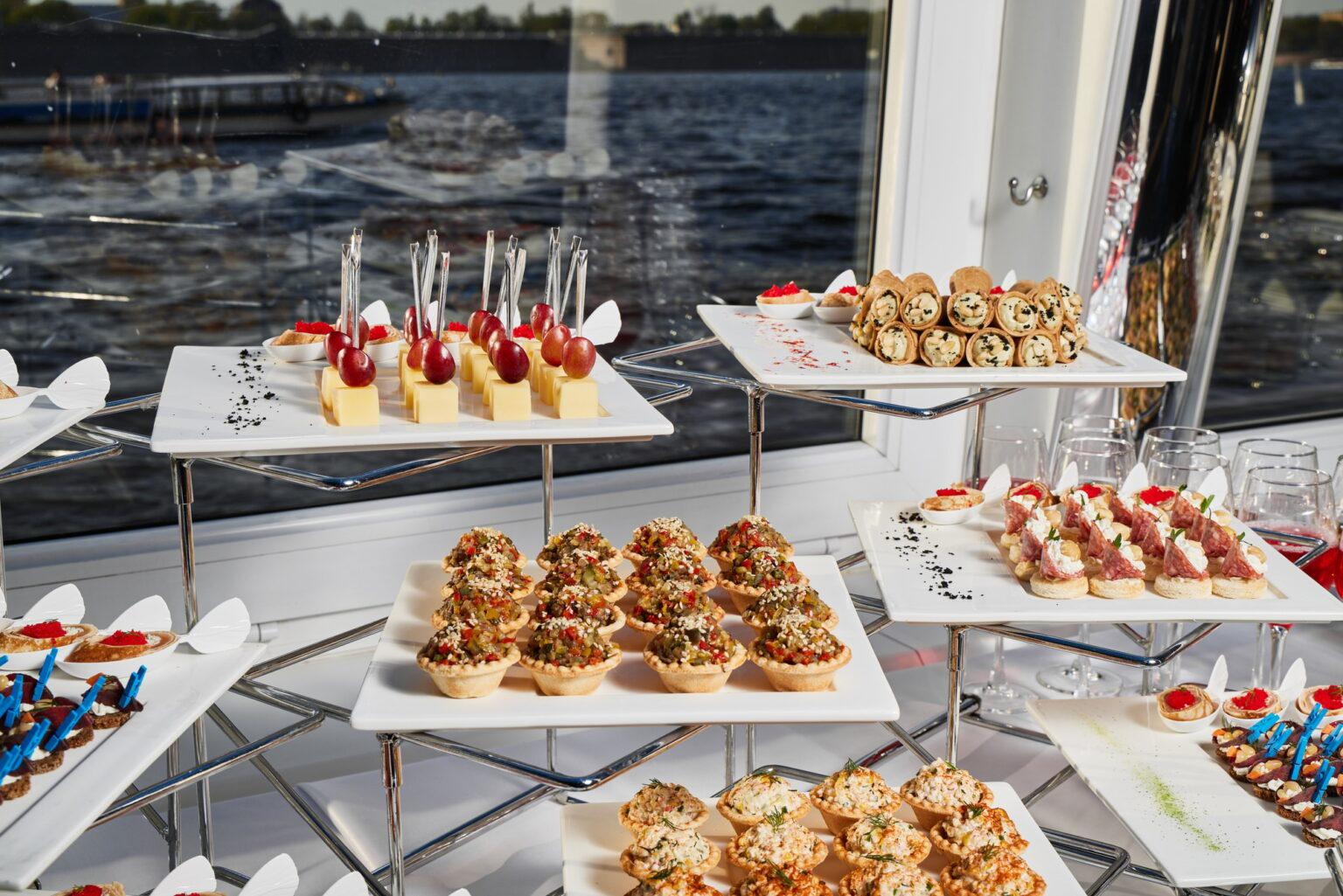 Enjoy an Elegant Catering Spread at a Beautiful Waterfront Event for a Memorable Affair