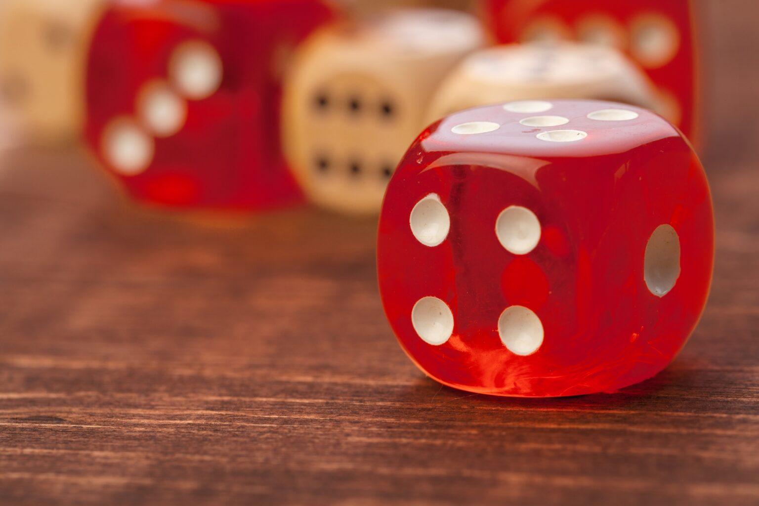 Dice on wooden table. Background for casino games