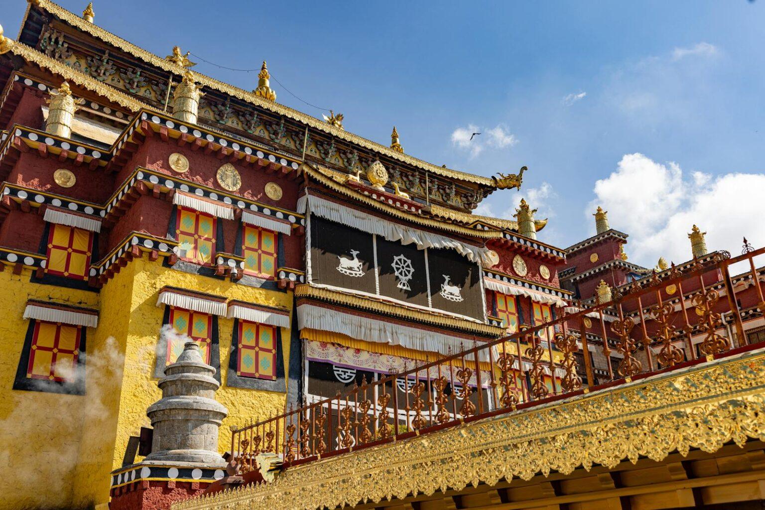Richly decorated Tibetan monastery exterior with vibrant colors and intricate designs.