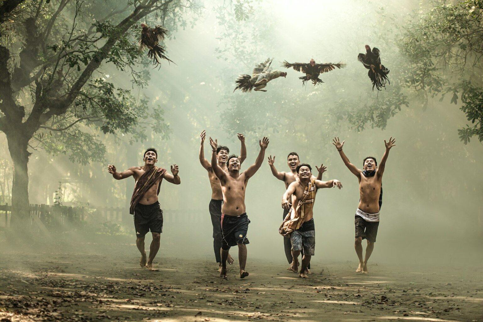 group of people standing on brown sand during daytime