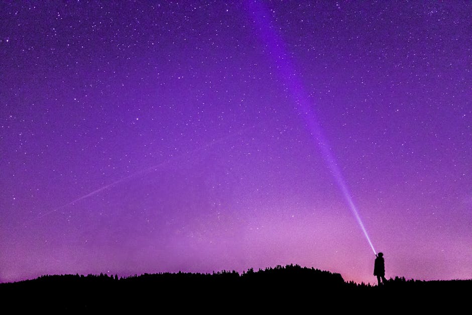Person standing under a starry night sky, feeling awe and wonder