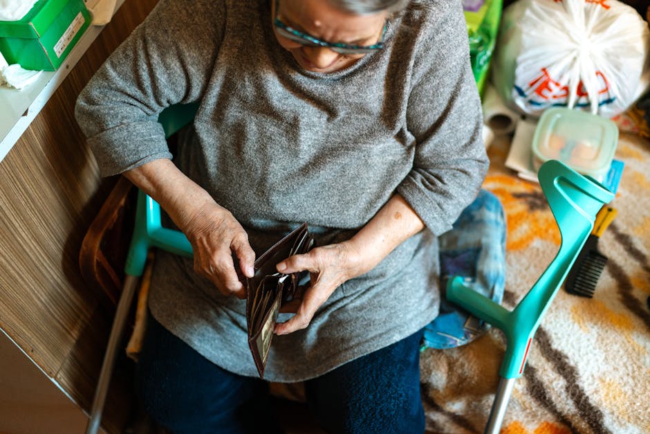 Older woman helping another senior in a care home