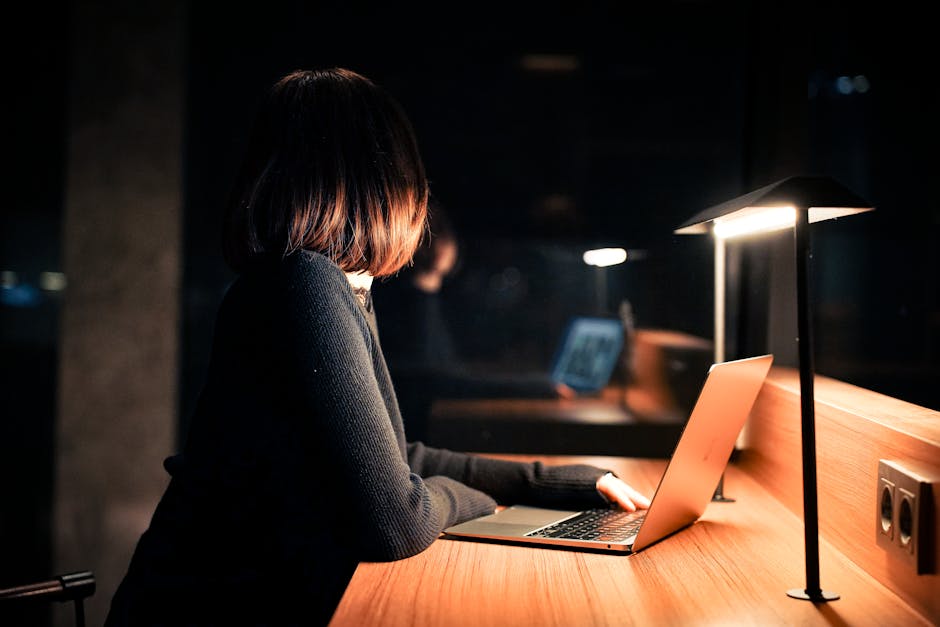 Person absorbed in deep focus at a desk with soft natural light