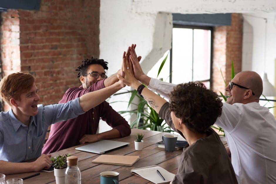 Two colleagues celebrating a professional success with a handshake