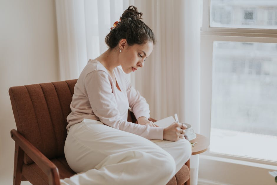 Person writing in journal with reflective and hopeful atmosphere