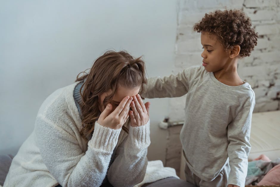 Parent comforting child after a fall, showing emotional support and resilience