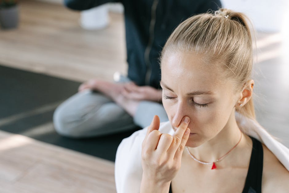 Person practicing mindfulness breathing in a quiet office space
