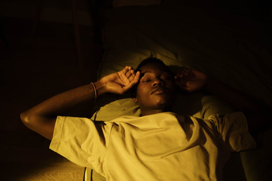 Calm person sleeping peacefully in bed at night