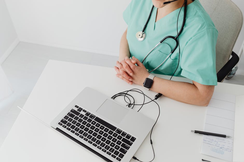 Patient using a telemonitoring app at home with a nurse reviewing health data on a laptop