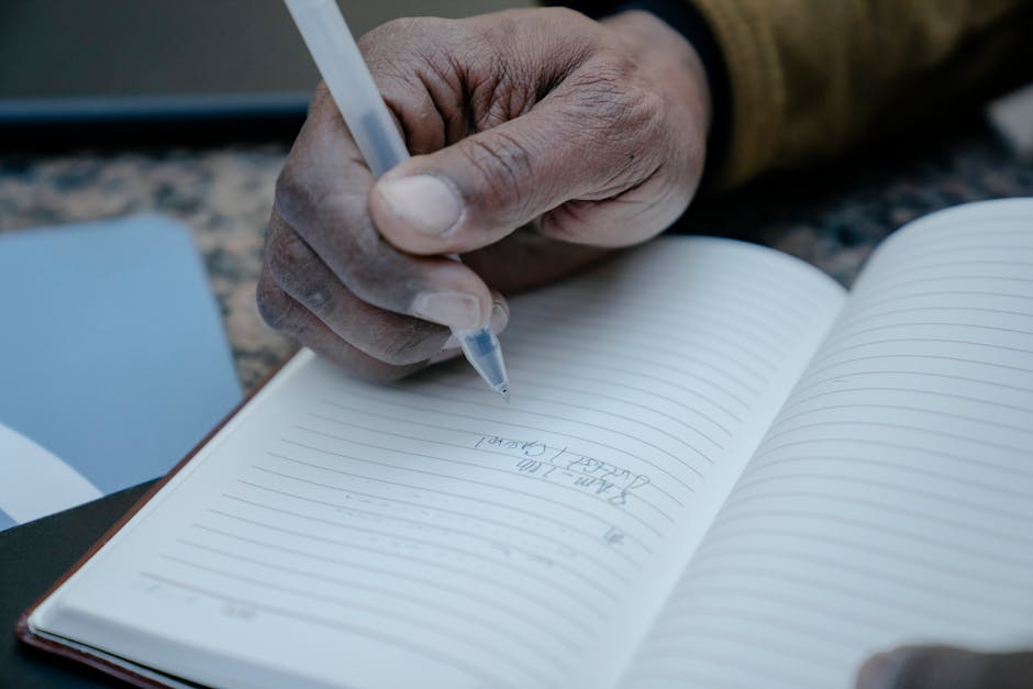 Hands holding a notebook with gratitude list
