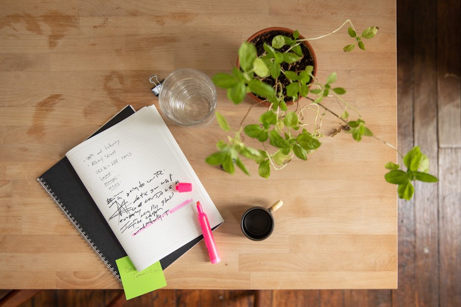 Person writing in a journal with a thoughtful reflective mood
