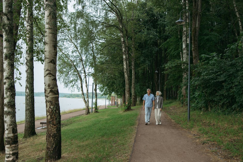 Senior couple walking outdoors in a park