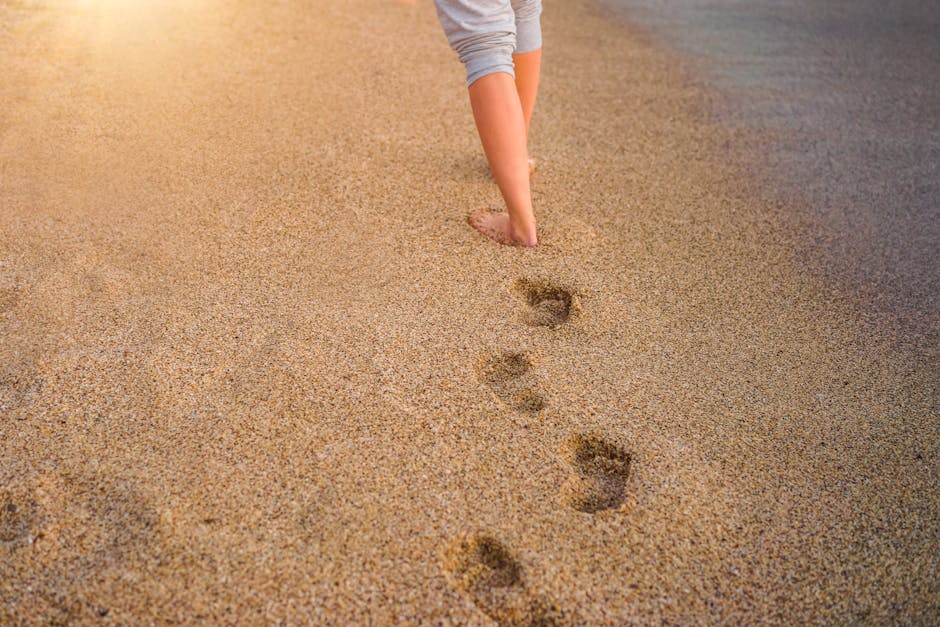 Close-up of feet walking on a path with attention to each step
