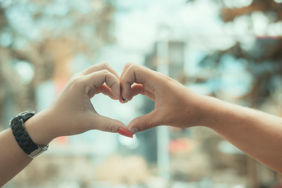 Two people sharing a warm compassionate moment outdoors