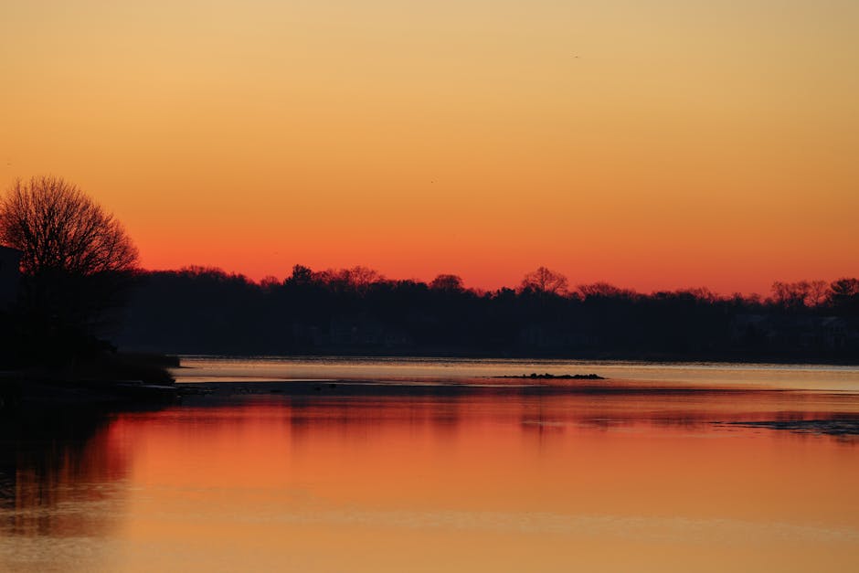 Peaceful sunrise over a quiet landscape symbolizing inner calm