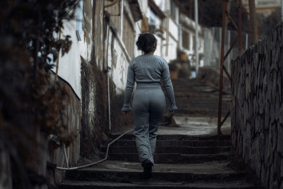 A person walking alone on a path with determination