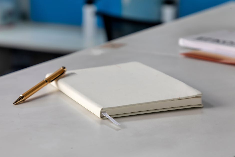 Quiet workspace with notebook and coffee for reflective creative work