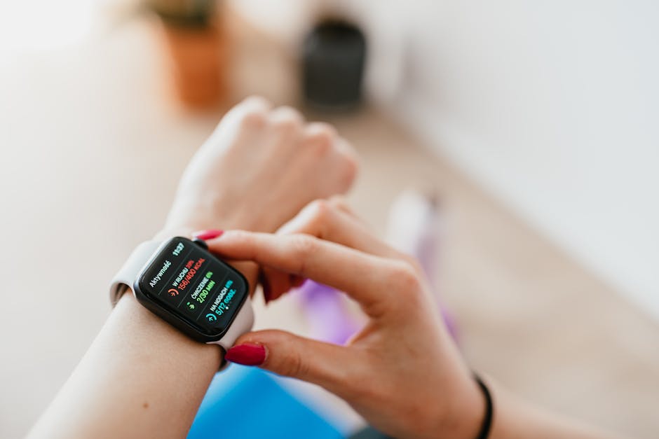 Person sitting quietly in meditation with heart rate monitor or smartwatch