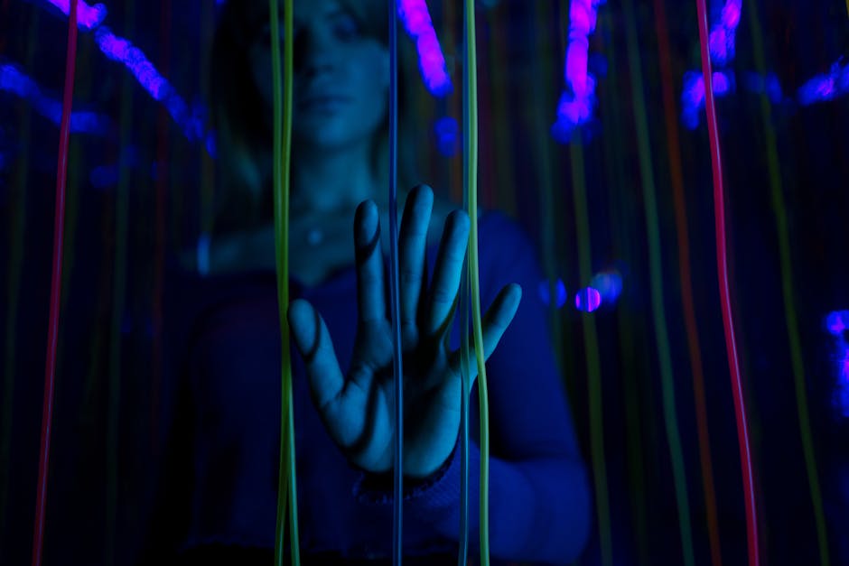 Person using a futuristic wellness pod in a calm sensory relaxation setting