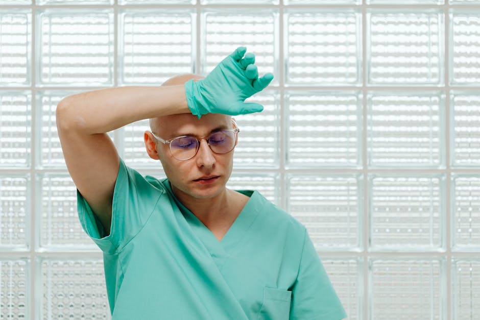Overworked medical team in a hospital corridor showing burnout and fatigue