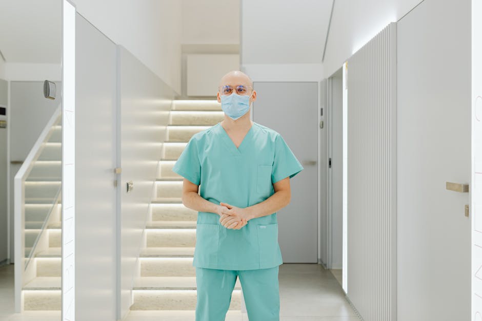 Healthcare worker meditating with eyes closed in a hospital office