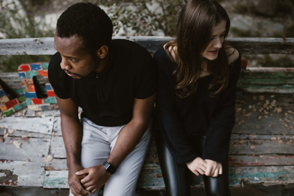 Couple separating or moving apart, symbolizing the grieving process after a breakup