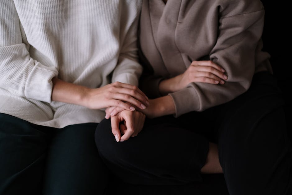 Warm human connection and supportive gesture between two people