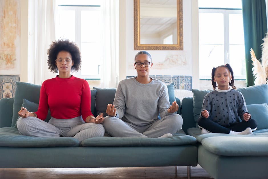 Parent taking a mindful pause while sitting quietly indoors