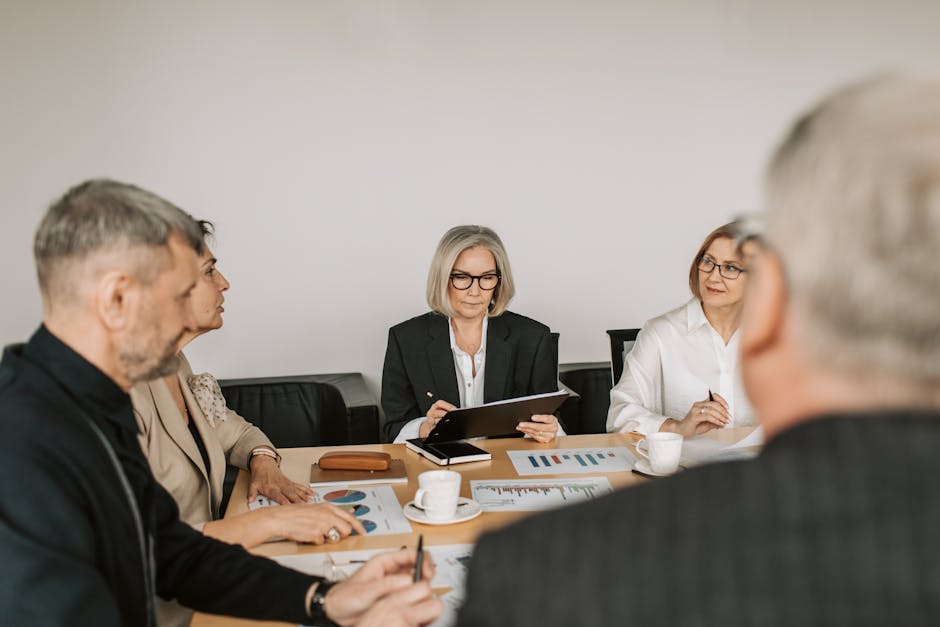 Business team meeting with a leader facilitating discussion