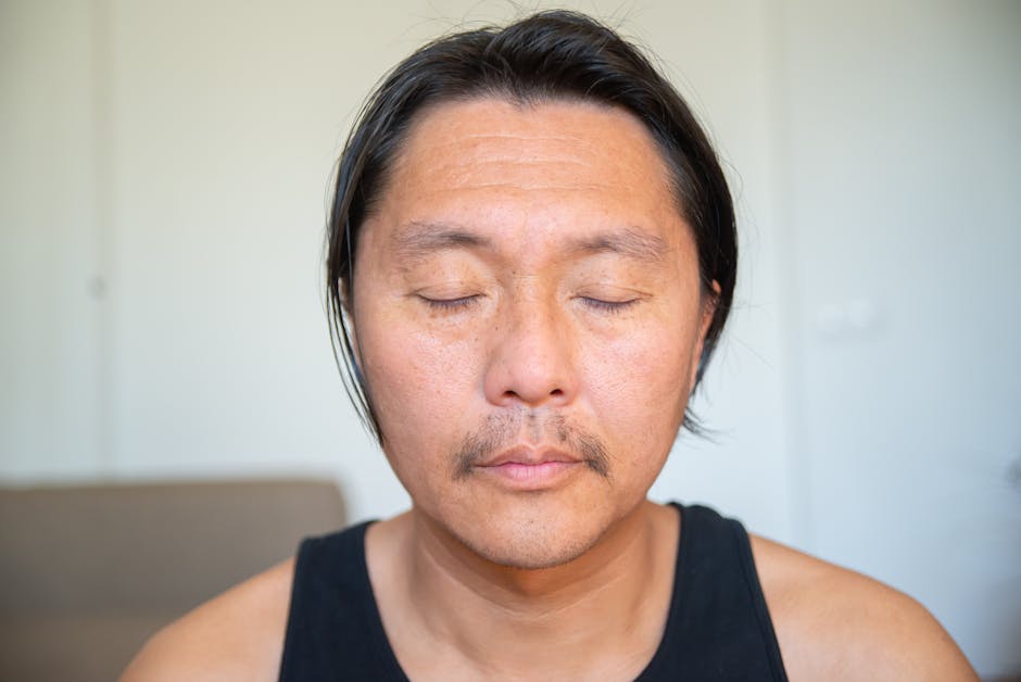 Close-up of a person meditating with eyes closed