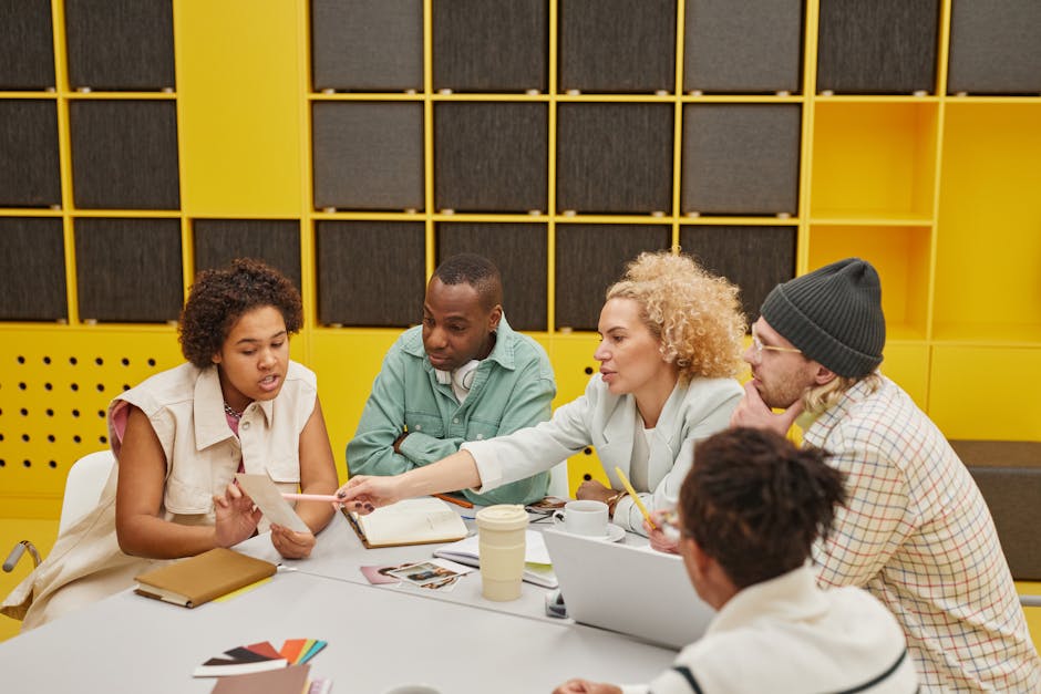 Engaged employees in a modern workplace discussing team performance