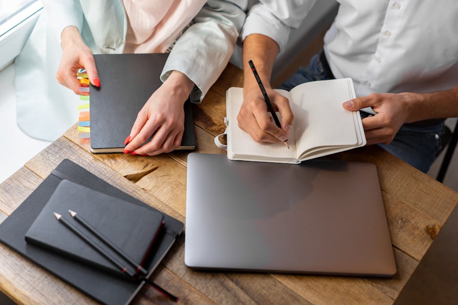 Professional planning a 30-day work improvement plan in a notebook