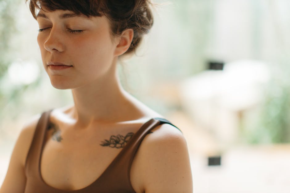 Person meditating in a calm seated posture with eyes closed