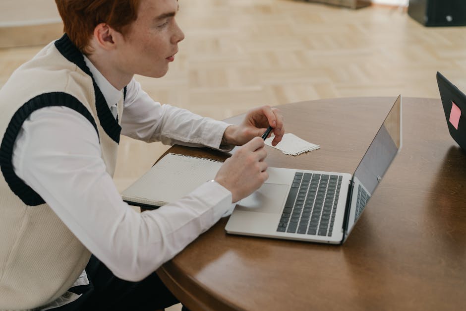 Person reviewing notes and learning in a thoughtful workspace