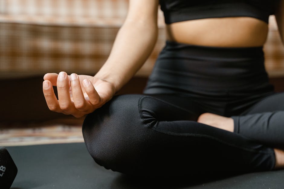 Calm woman practicing breathing exercise in a seated meditation pose