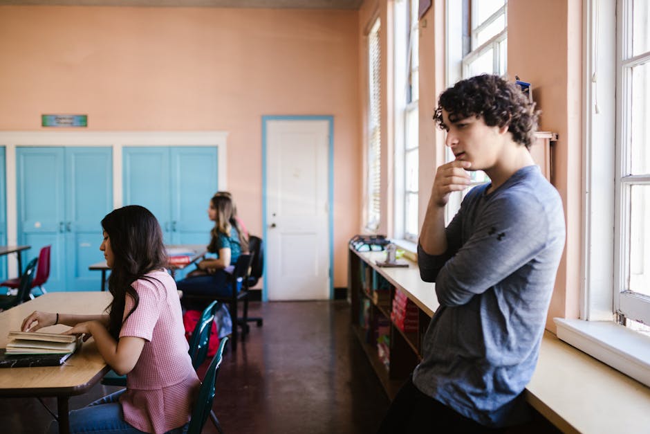 Adolescents meditating in a classroom setting