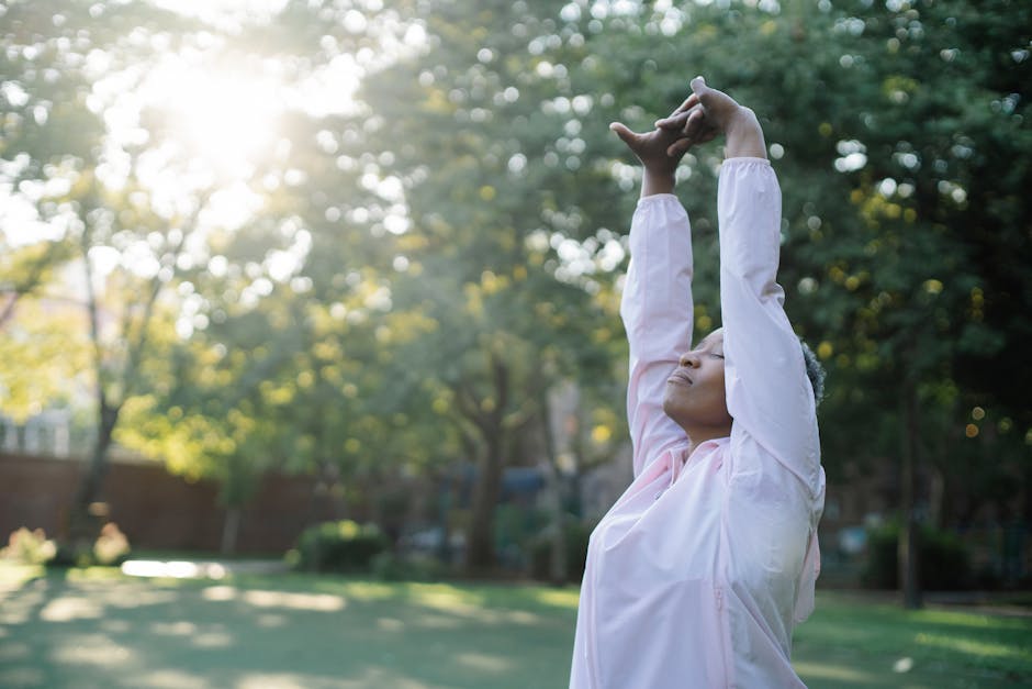 Person practicing gentle yoga or tai chi outdoors for chronic pain relief