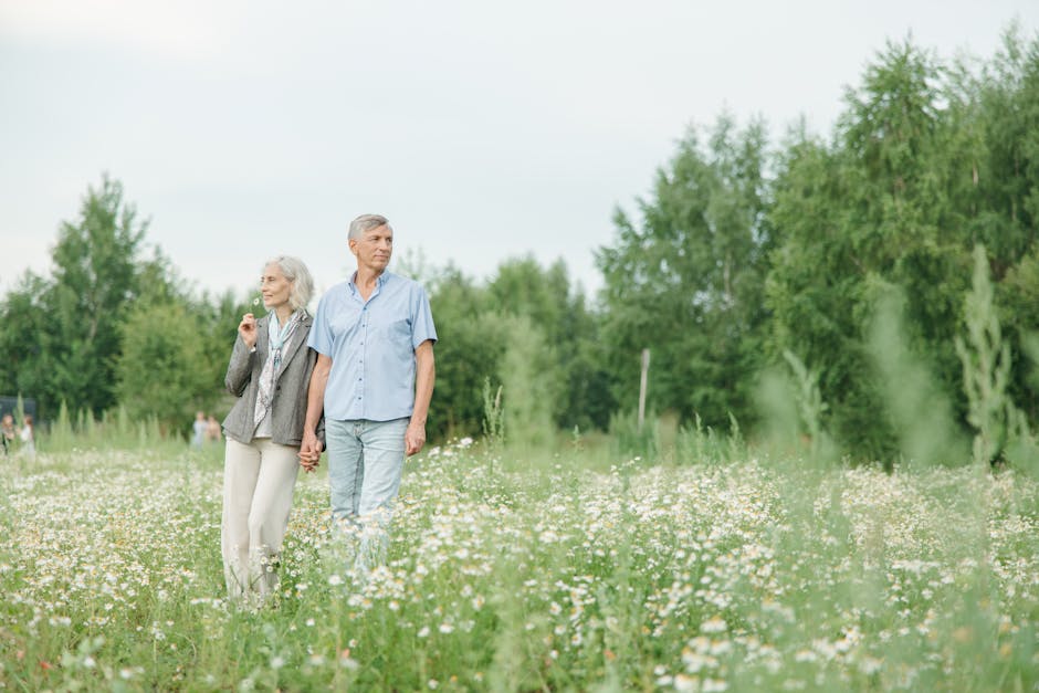 Senior couple walking slowly in a park with mindful awareness