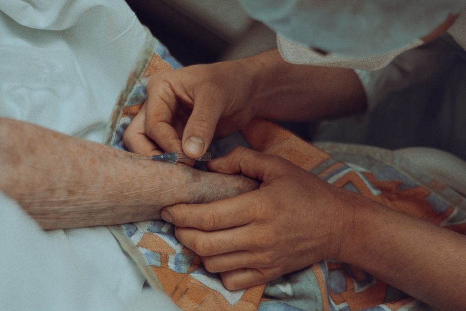Healthcare professional offering calm support to a patient