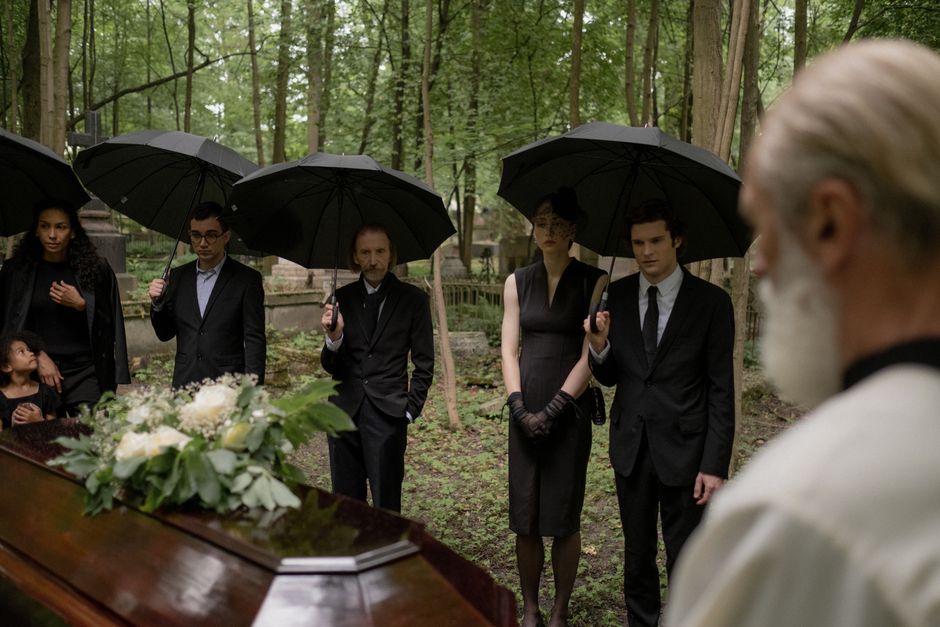 Family gathered around a funeral memorial ceremony
