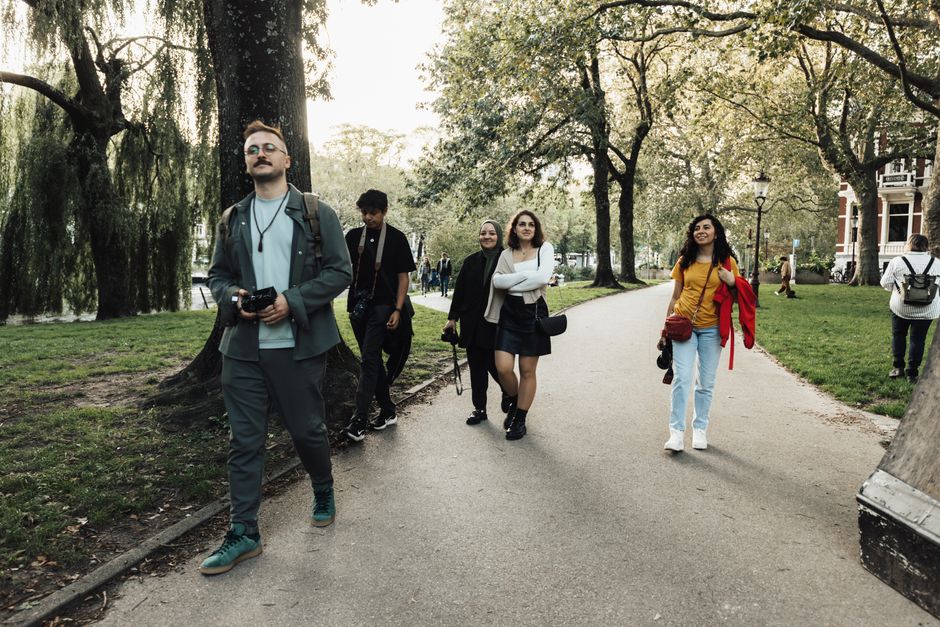 Small group of adults walking together outdoors