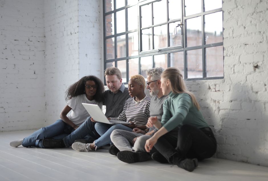 Online support group chat on a laptop with warm lighting