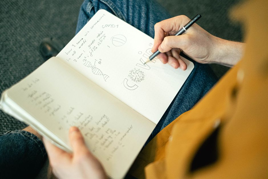 A notebook with a hand-drawn journey map and milestones, representing a therapeutic life path exercise