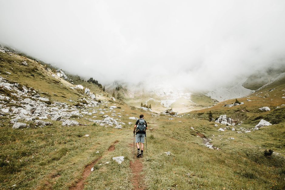 A symbolic path through mountains and mist, representing the stages of a hero's journey