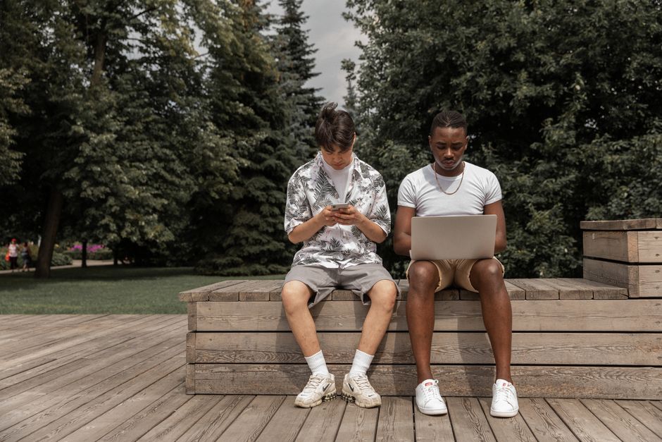 People connecting in an online community on laptops and smartphones