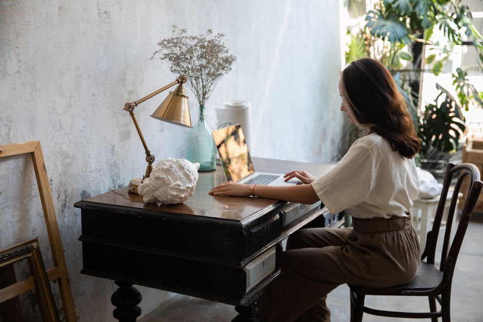Balanced life concept with work and personal time represented by desk and home elements