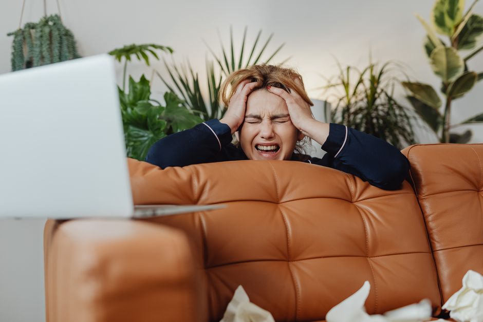 Overwhelmed parent surrounded by daily life stress
